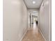 Bright hallway features tile floors and neutral walls, leading to the living area and backyard at 2053 E Saddlebrook Ct, Gilbert, AZ 85298