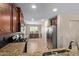 A bright kitchen boasts ample counter space, stainless steel appliances, and warm wood cabinets at 2053 E Saddlebrook Ct, Gilbert, AZ 85298