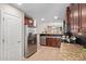 Well-equipped kitchen with stainless steel appliances, granite countertops, and custom cabinetry at 2053 E Saddlebrook Ct, Gilbert, AZ 85298