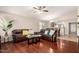 Living room with hardwood flooring and comfortable seating, connecting to dining and kitchen areas at 2053 E Saddlebrook Ct, Gilbert, AZ 85298