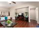 Cozy living room with hardwood floors and a stylish entertainment center, perfect for relaxation at 2053 E Saddlebrook Ct, Gilbert, AZ 85298