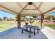 Covered picnic area with table and seating in a community park at 2053 E Saddlebrook Ct, Gilbert, AZ 85298