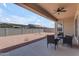 Backyard features a covered patio with ceiling fan and seating, perfect for enjoying the Arizona weather at 22788 E Orion Way, Queen Creek, AZ 85142
