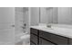 Bathroom showcasing a modern vanity with a sink and a shower-tub combination at 22788 E Orion Way, Queen Creek, AZ 85142