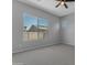 Bedroom featuring neutral walls, carpet, and a window with neighborhood views at 22788 E Orion Way, Queen Creek, AZ 85142