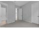 Open bedroom with gray walls, carpet, and two doorways at 22788 E Orion Way, Queen Creek, AZ 85142