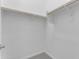 Empty walk-in closet with white walls and carpet at 22788 E Orion Way, Queen Creek, AZ 85142