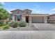 Charming single-story home with desert landscaping, a paver driveway, and a two-car garage at 22788 E Orion Way, Queen Creek, AZ 85142