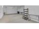 Spacious two car garage with tables, shelving, and storage space for tools and other items at 22788 E Orion Way, Queen Creek, AZ 85142