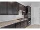 Well-equipped kitchen featuring stainless steel appliances, granite countertops, and ample cabinet space at 22788 E Orion Way, Queen Creek, AZ 85142
