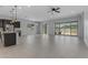 Open concept living room boasting tile floors and sliding doors with backyard views at 22788 E Orion Way, Queen Creek, AZ 85142