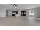 Open floor plan with a kitchen featuring an island, stainless appliances, and tile flooring at 22788 E Orion Way, Queen Creek, AZ 85142