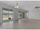 Bright living room featuring tile floors and sliding doors to the outside patio at 22788 E Orion Way, Queen Creek, AZ 85142