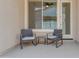 Outdoor seating area with a pair of chairs and a table for relaxing on the covered patio at 22788 E Orion Way, Queen Creek, AZ 85142