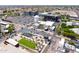 An aerial view of a town center, highlighting its water tower, modern buildings, green spaces, and well-organized parking at 2338 E Javelina Ave, Mesa, AZ 85204