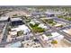 Aerial view of a city center featuring a historic water tower, modern buildings, streets, and ample parking space at 2338 E Javelina Ave, Mesa, AZ 85204