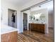 Spacious bathroom featuring dual sinks, wood cabinets, and a large mirror at 2338 E Javelina Ave, Mesa, AZ 85204