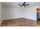 Bedroom featuring hardwood floors and ceiling fan with light at 2338 E Javelina Ave, Mesa, AZ 85204