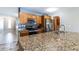 Spacious kitchen featuring granite countertops, stainless steel appliances, and oak cabinetry at 2338 E Javelina Ave, Mesa, AZ 85204