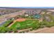 A pristine baseball field with lush green grass, perfect for community sports and recreation at 27667 W Mohawk Ln, Buckeye, AZ 85396