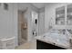 Modern bathroom featuring granite counters, a tile shower, and neutral color scheme at 27667 W Mohawk Ln, Buckeye, AZ 85396
