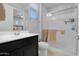 Modern bathroom featuring a new vanity, glass shower, and toilet at 27667 W Mohawk Ln, Buckeye, AZ 85396