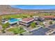 Community clubhouse featuring a pool, golf course views, and convenient parking at 27667 W Mohawk Ln, Buckeye, AZ 85396