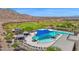 The community pool features shaded seating and beautiful views of the golf course at 27667 W Mohawk Ln, Buckeye, AZ 85396