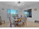 Cozy dining room with natural light, a ceiling fan, and comfortable seating at 27667 W Mohawk Ln, Buckeye, AZ 85396