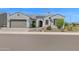 Attractive single-story home featuring a front yard with desert landscaping at 27667 W Mohawk Ln, Buckeye, AZ 85396