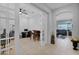 Spacious office with bar, French doors, and views of the living area at 27667 W Mohawk Ln, Buckeye, AZ 85396