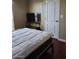Bedroom featuring a modern bed frame, TV and adjacent doorway at 2929 E Main St # 601, Mesa, AZ 85213