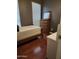 This bedroom has a bed, wood floor, and dresser at 2929 E Main St # 601, Mesa, AZ 85213