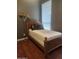 Bed frame with wood floors and stylish decor create a comfortable retreat at 2929 E Main St # 601, Mesa, AZ 85213