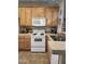 Efficient kitchen boasts wood cabinetry, modern appliances, and a practical layout at 2929 E Main St # 601, Mesa, AZ 85213