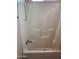 Bathroom with white tiled tub and shower and built-in shelves at 2929 E Main St # 601, Mesa, AZ 85213