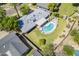 Aerial view of a property with a private pool and lush green backyard at 314 E Royal Palm Rd, Phoenix, AZ 85020