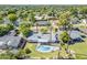 Aerial view showcasing a home with a private backyard oasis including a kidney shaped pool, covered patio, and lush landscaping at 314 E Royal Palm Rd, Phoenix, AZ 85020