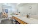 Stylish bathroom featuring a quartz countertop, wooden cabinets, and tiled floors at 314 E Royal Palm Rd, Phoenix, AZ 85020