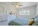 Serene bedroom with neutral tones, ceiling fan, and ample natural light at 314 E Royal Palm Rd, Phoenix, AZ 85020