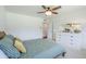 Spacious bedroom featuring a ceiling fan and dresser with mirror creates a relaxing retreat at 314 E Royal Palm Rd, Phoenix, AZ 85020