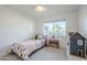 Inviting bedroom with a twin bed, window with a view, and playful decor at 314 E Royal Palm Rd, Phoenix, AZ 85020