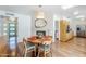 Inviting dining room featuring wood floors, a stone fireplace and modern lighting at 314 E Royal Palm Rd, Phoenix, AZ 85020