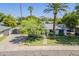 Charming single-story home with mature trees and a well-manicured lawn at 314 E Royal Palm Rd, Phoenix, AZ 85020