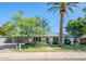Charming single-story home with mature trees and a well-manicured lawn at 314 E Royal Palm Rd, Phoenix, AZ 85020