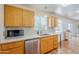 Well-lit kitchen with stainless steel appliances, hardwood floors, and modern finishes at 314 E Royal Palm Rd, Phoenix, AZ 85020