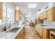 Bright kitchen boasts hardwood flooring, ample natural light, and stylish design at 314 E Royal Palm Rd, Phoenix, AZ 85020