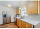 Modern kitchen with stainless steel appliances, hardwood floors, and quartz countertops at 314 E Royal Palm Rd, Phoenix, AZ 85020