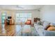 Bright living room with wood floors, a large window, and modern furniture at 314 E Royal Palm Rd, Phoenix, AZ 85020