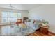 Comfortable living room featuring hardwood floors, a large window, and stylish decor at 314 E Royal Palm Rd, Phoenix, AZ 85020